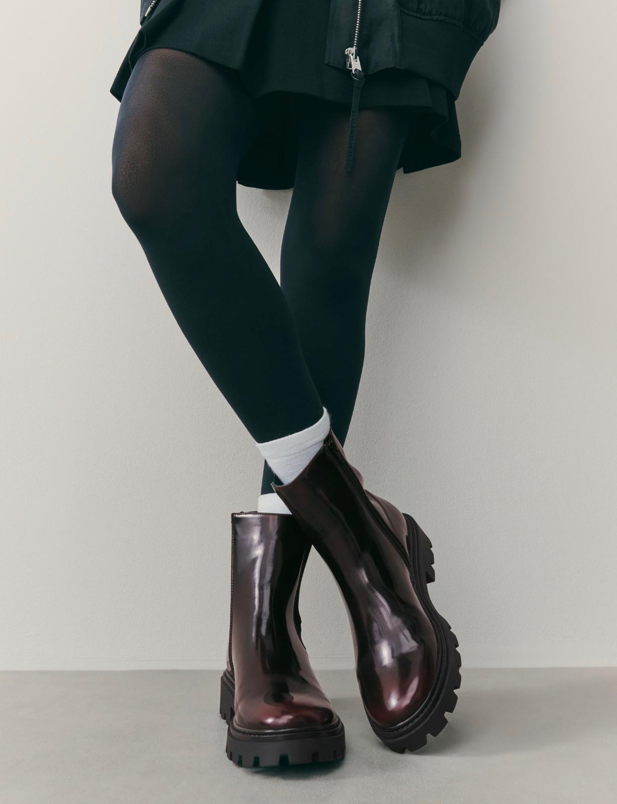 Bottes noires reflet bordeaux Next