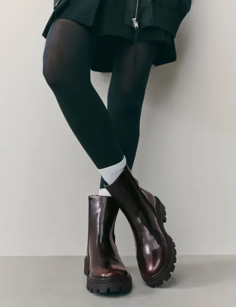 Bottes noires reflet bordeaux Next